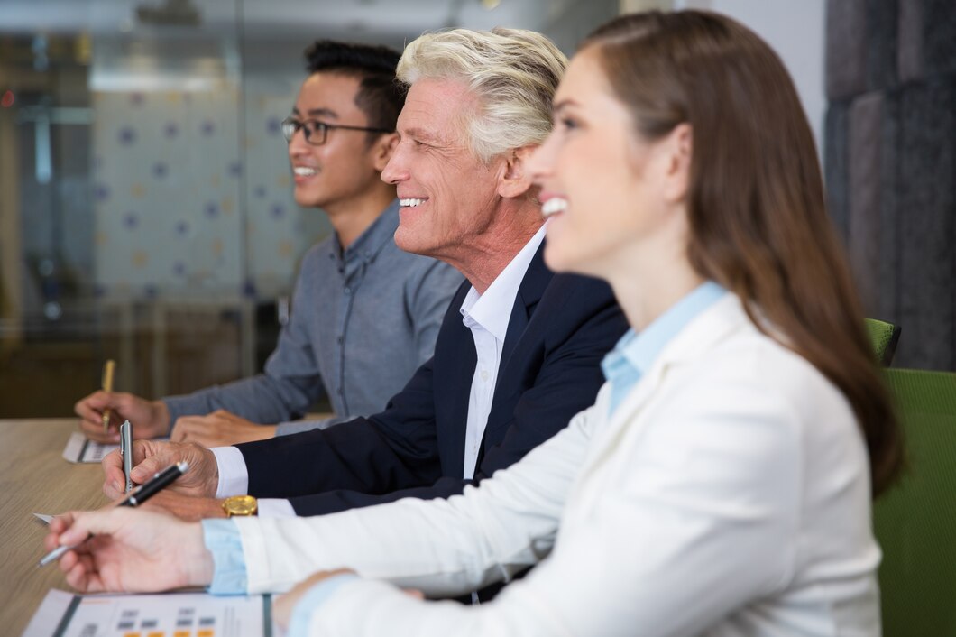 smiling senior businessman sitting conference 1262 2322